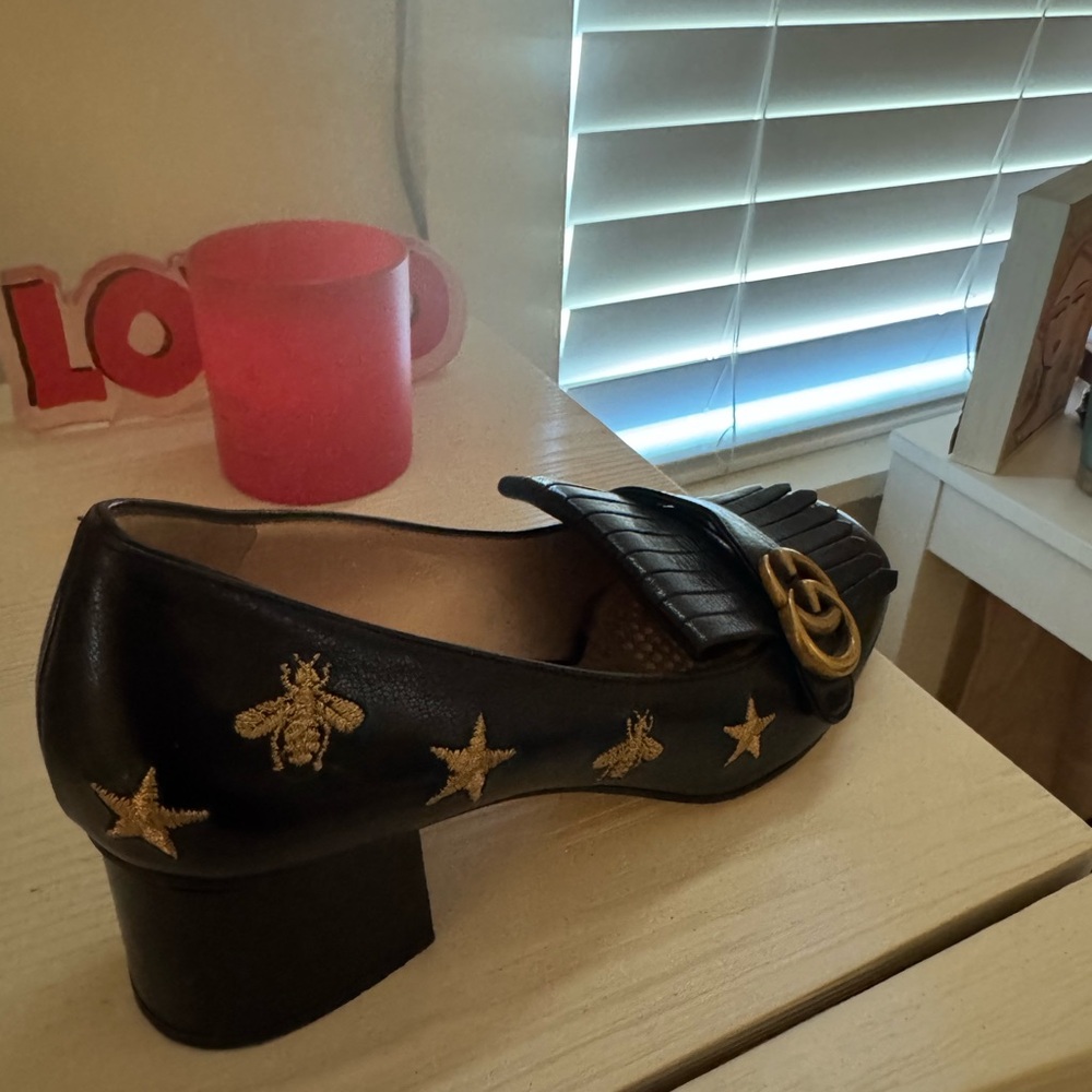 Gucci Black Leather Loafers with Gold Embellishments